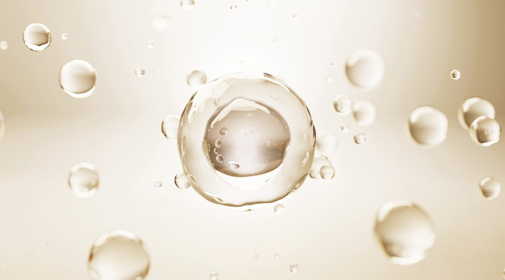 Three-dimensional illustration of a Natural Killer cell surrounded by droplets